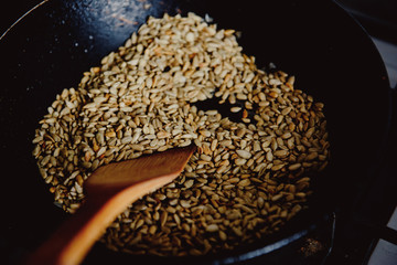 peeled sunflower seeds on a dark background