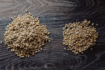 peeled sunflower seeds on a dark background