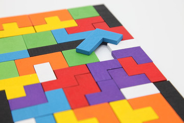 Different colorful shapes wooden blocks.Geometric shapes in different colors. Concept of creative, logical thinking or problem solving.Geometric shapes on wooden background.Tetris toy wooden blocks.
