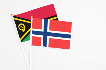 Norway and Vanuatu stick flags on white background. High quality fabric, miniature national flag....