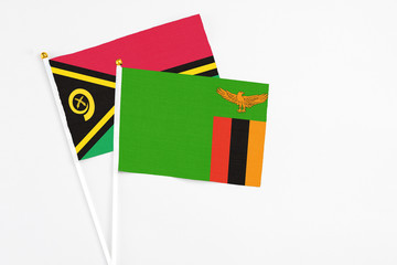 Zambia and Vanuatu stick flags on white background. High quality fabric, miniature national flag....