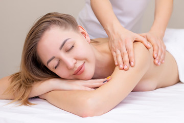 Fototapeta na wymiar Massage and body care. Spa body massage woman hands treatment. Woman having massage in the spa salon for beautiful girl