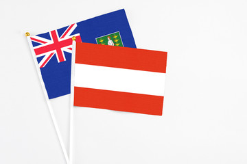 Austria and British Virgin Islands stick flags on white background. High quality fabric, miniature national flag. Peaceful global concept.White floor for copy space.