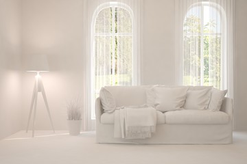 Fototapeta premium Mock up of stylish room in white color with sofa. Scandinavian interior design. 3D illustration