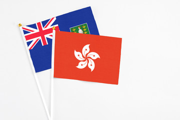 Hong Kong and British Virgin Islands stick flags on white background. High quality fabric, miniature national flag. Peaceful global concept.White floor for copy space.
