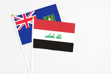 Iraq and British Virgin Islands stick flags on white background. High quality fabric, miniature national flag. Peaceful global concept.White floor for copy space.