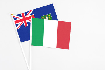 Italy and British Virgin Islands stick flags on white background. High quality fabric, miniature national flag. Peaceful global concept.White floor for copy space.