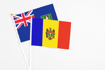 Moldova and British Virgin Islands stick flags on white background. High quality fabric, miniature national flag. Peaceful global concept.White floor for copy space.