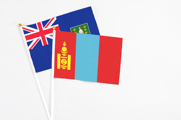 Mongolia and British Virgin Islands stick flags on white background. High quality fabric, miniature national flag. Peaceful global concept.White floor for copy space.