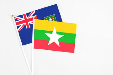 Myanmar and British Virgin Islands stick flags on white background. High quality fabric, miniature national flag. Peaceful global concept.White floor for copy space.