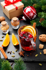 Christmas mulled wine or gluhwein with spices and orange slices.