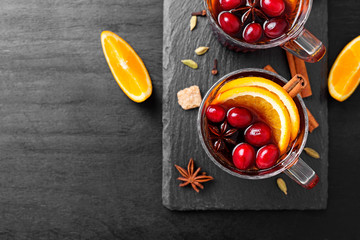 Christmas mulled wine or gluhwein with spices and orange slices.