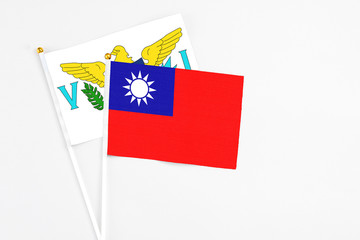 Taiwan and United States Virgin Islands stick flags on white background. High quality fabric, miniature national flag. Peaceful global concept.White floor for copy space.