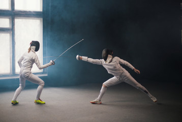 A fencing training - two women having a duel