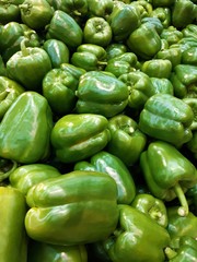 Obraz na płótnie Canvas closeup of a large green fresh fragrant pepper in a store