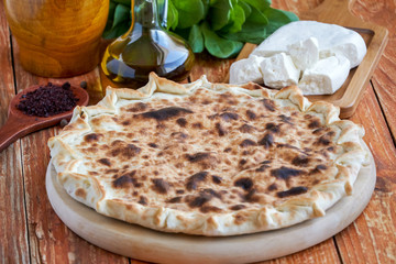 Pie with spinach and cheese with ingredients  . Cheese Manakish    