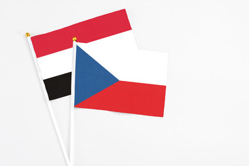 Czech Republic and Yemen stick flags on white background. High quality fabric, miniature national flag. Peaceful global concept.White floor for copy space.