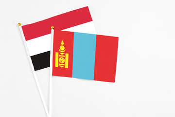 Mongolia and Yemen stick flags on white background. High quality fabric, miniature national flag. Peaceful global concept.White floor for copy space.