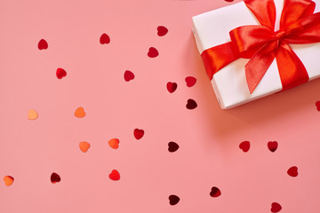 Valentines day background with gift and confetti.