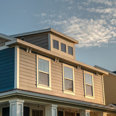 Square Sash windows in the upper floor of a timber house