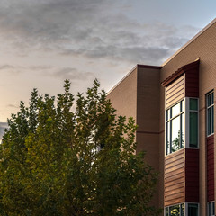 Square frame Corner of modern two storey building near sunset