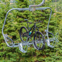 Fototapeta na wymiar Square Lift accessed mountain biking with bikes on chairlifts in Park City in summer