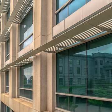 Square Frame Close Up Of The Glass Windows And Concrete Exterior Wall Of A Modern Building