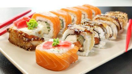 Japanese seafood sushi. Philadelphia and Canada sushi rolls on a plate.