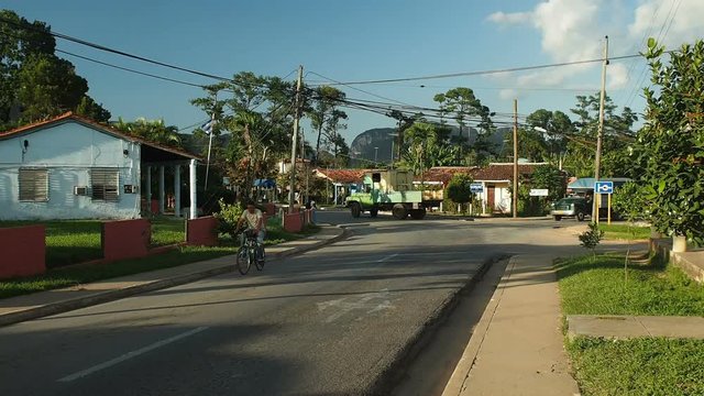 View on small street in Vi&ntilde;ales near famous Vi&ntilde;ales Valley which could be seen on background, Pinar del Rio, Cuba