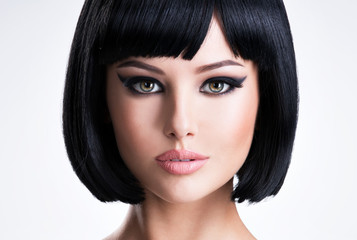 Beautiful brunette woman with short hairstyle.