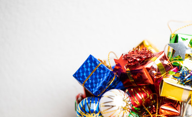 Christmas tree, gift box and ball colour on the wood table and copy space