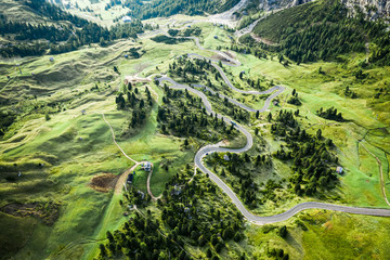 Aerial view of serpentine leading to Passo Gardena, Dolomites - obrazy, fototapety, plakaty