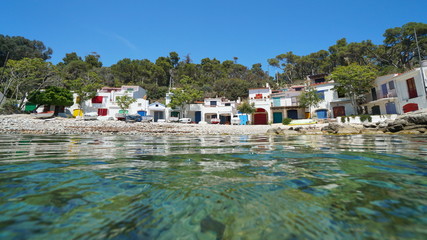 Sea shore with fishermen houses and boats on the Mediterranean coast in Spain, Costa Brava, Cala...