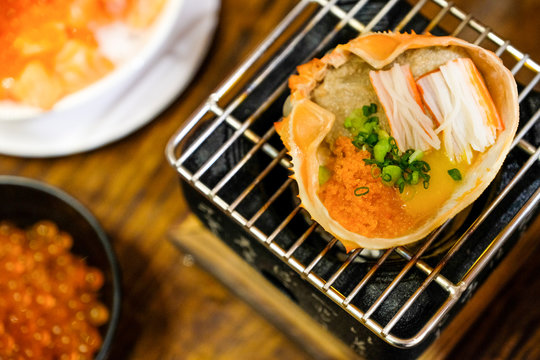 Close up delicious crab boiled grill Kani Miso ( Japanese food ) on table  