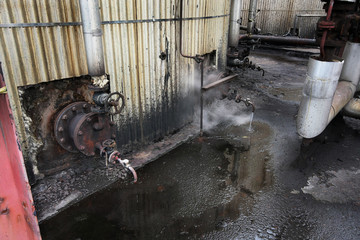 Steam, dirt and general unkept areas in large chemical plant.