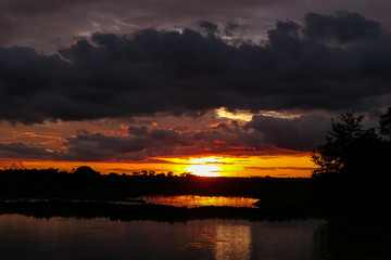 Fototapeta premium Moody sunset over a river in Pantanal Wetlands, Mato Grosso, Brazil
