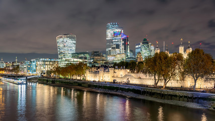 Fototapeta na wymiar London Cityscape about the bank of Thames river. Amazing skyscrapesrs, cloudly sky and splendid city lights. Autumn mood. Tower of London.