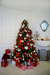 Christmas tree is dressed up in a home room.