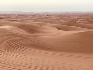 Fototapeta na wymiar car tracks in the desert