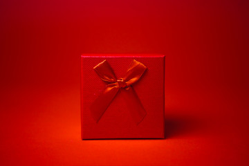 Gift box on red background