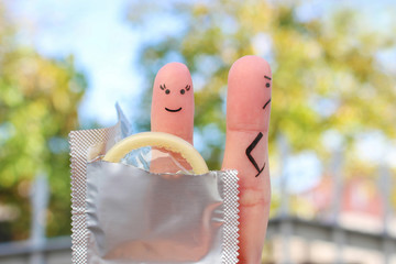 Fingers art of couple. Concept of man refuse to use condom. Unprotected sex.