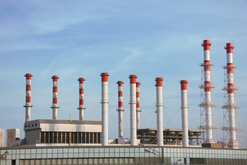 Many red-white pipes from the city heat station.
