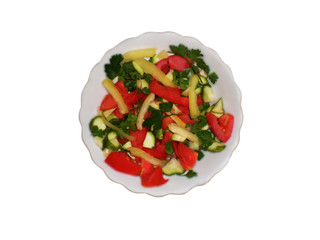 Vegetable salad with cucumber, tomato, parsley, onion, garlic and sweet pepper on a white background