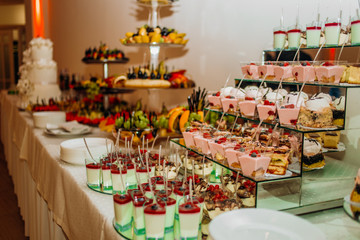 Sweet desert on the table. Different desserts on candy bar