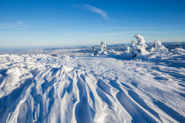 Fototapeta na wymiar Closeup of frozen snow in heavy winter. details.