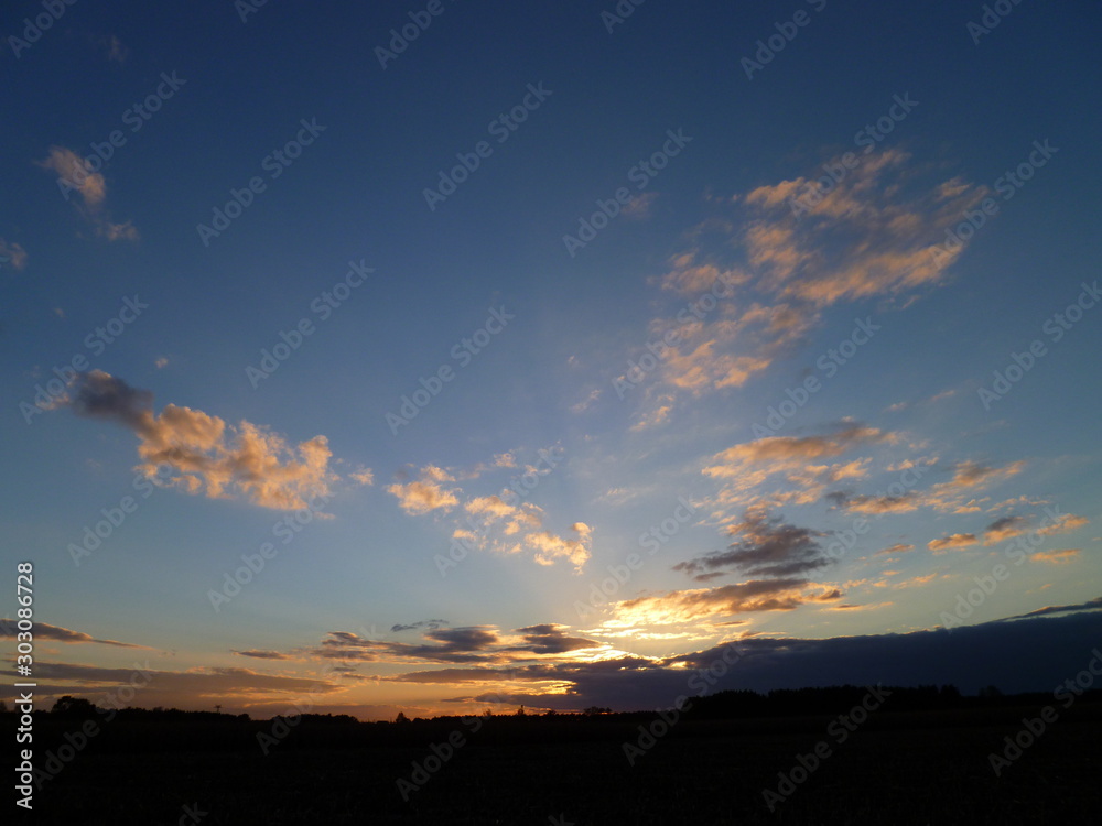 Wall mural sunset sky on the field