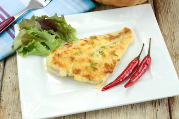 Millet fish fillet on a plate