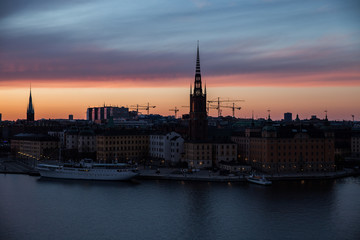 Obraz premium Stockholm at dusk with fireworks.