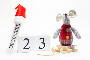 Wooden calendar with number December 23. Happy New Year! Symbol of New Year 2020 - white or metal (silver) rat. Christmas decorated.