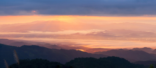 Panoramic view of mountains at sunrise.